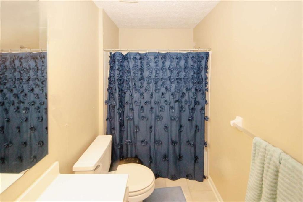 4025 Ivy Run Circle Duluth, GA 30096 - Photo 19 of 34 a bathroom with a toilet and a shower