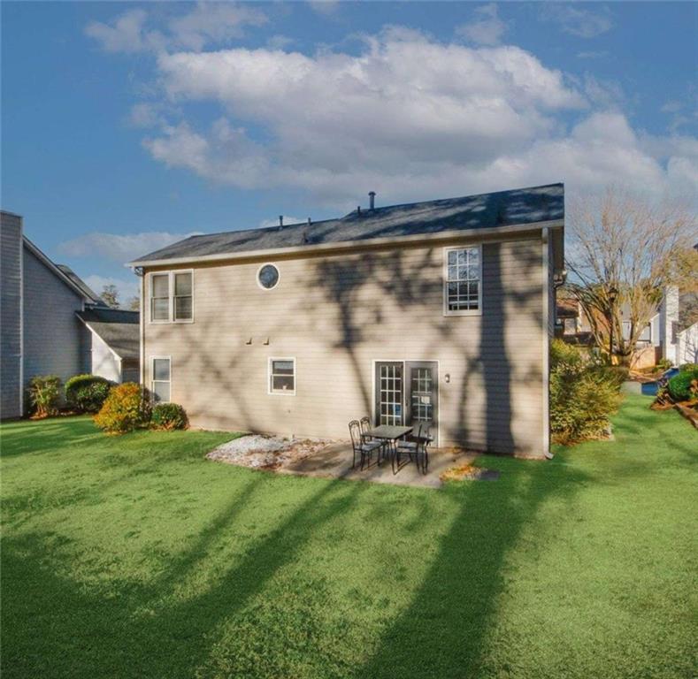 4025 Ivy Run Circle Duluth, GA 30096 - Photo 21 of 34 a front view of a house with garden