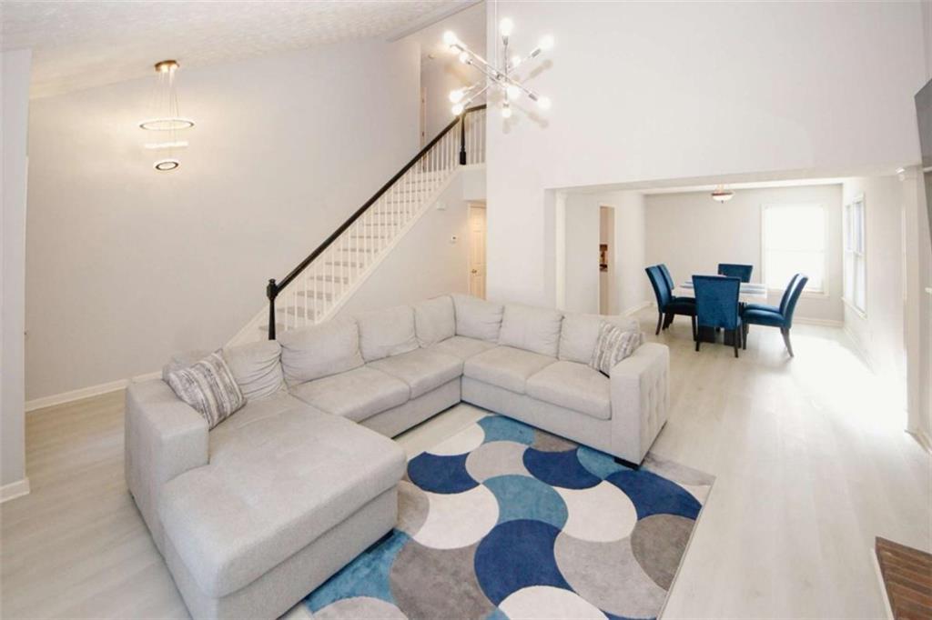 4025 Ivy Run Circle Duluth, GA 30096 - Photo 4 of 34 a living room with furniture and wooden floor