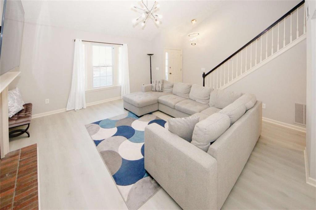 4025 Ivy Run Circle Duluth, GA 30096 - Photo 5 of 34 a living room with furniture and wooden floor
