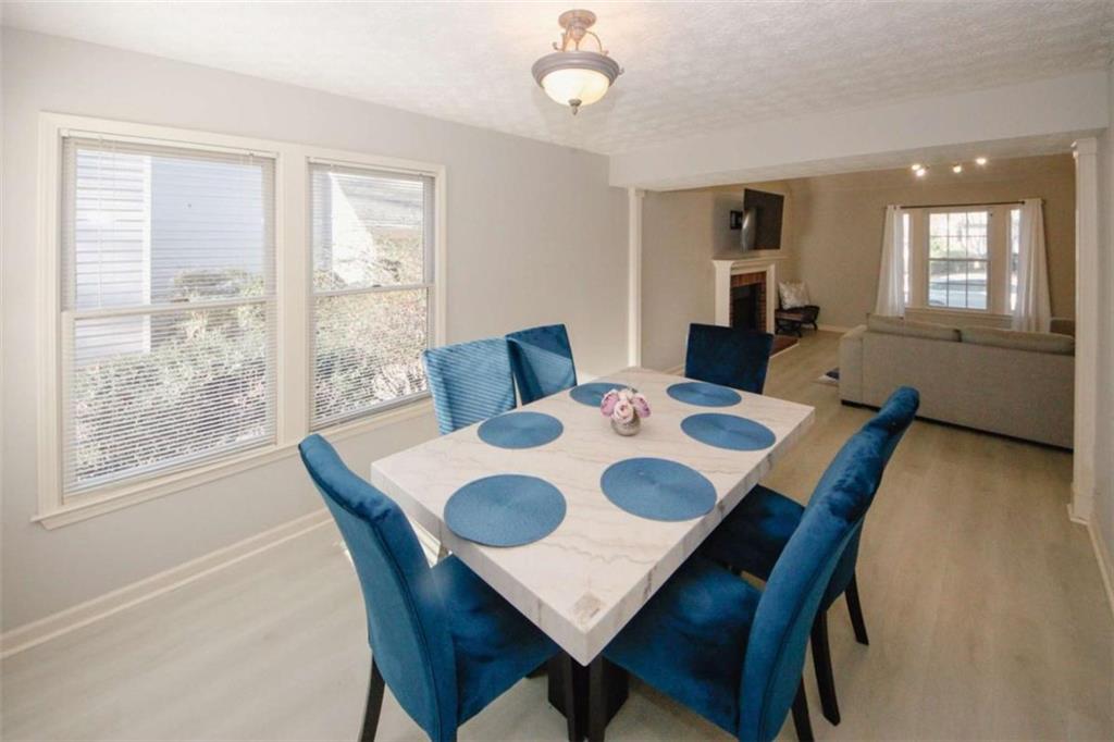 4025 Ivy Run Circle Duluth, GA 30096 - Photo 9 of 34 a view of a dining room with furniture window and wooden floor