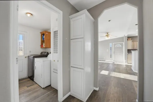 a view of hallway with wooden floor