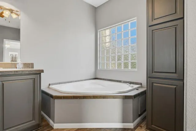a bathroom with a bathtub and a sink