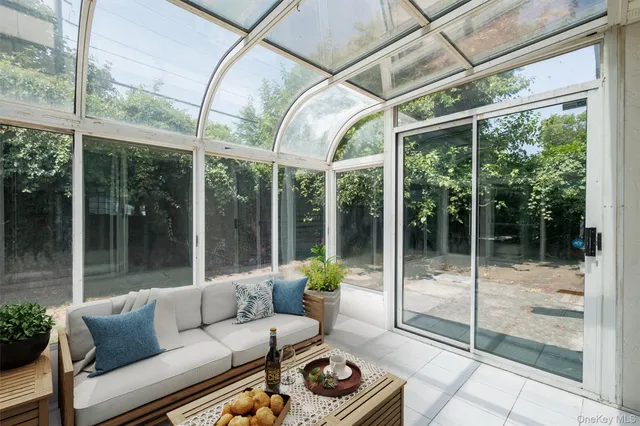 a balcony with furniture and garden
