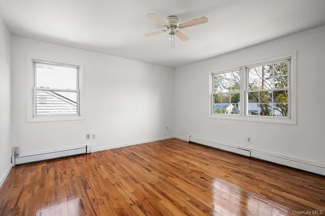 a bathroom with a sink a toilet a shower and a mirror