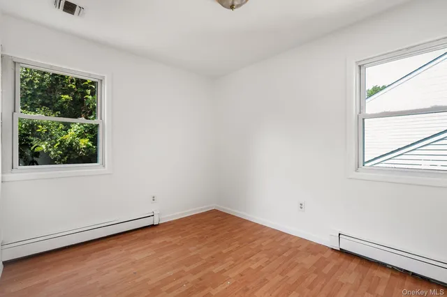 a view of a house with backyard sitting area and garden