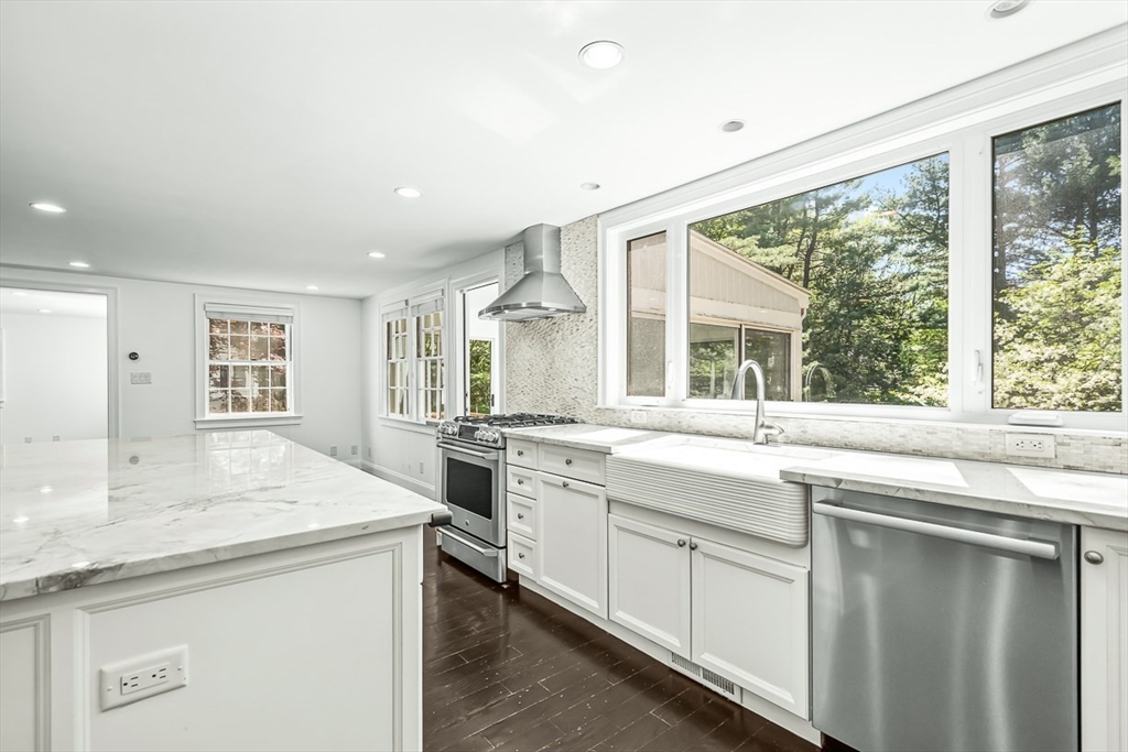 53 Madison Road Wellesley, MA 02481 - Photo 5 of 18 a kitchen with a sink stove and cabinets