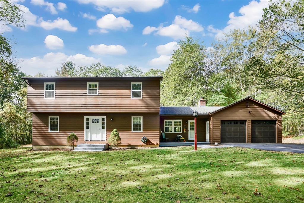 56 Reservoir Road Westhampton, MA 01027 - Photo 1 of 42 a front view of a house with a yard