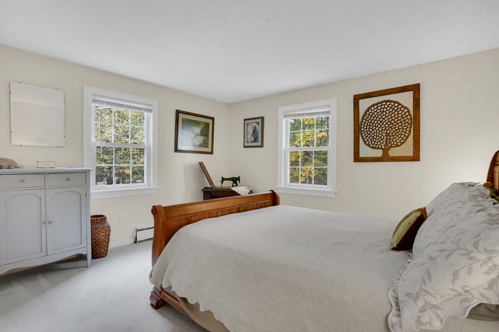 56 Reservoir Road Westhampton, MA 01027 - Photo 26 of 42 a bedroom with a bed and a cabinets