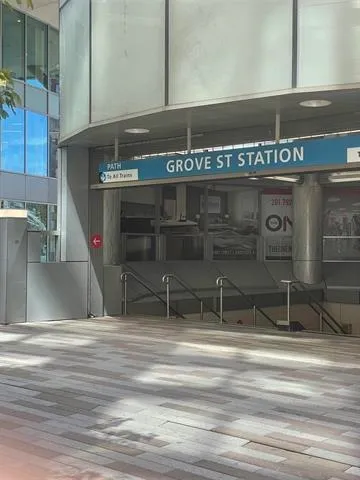 a street view of a building with sitting area
