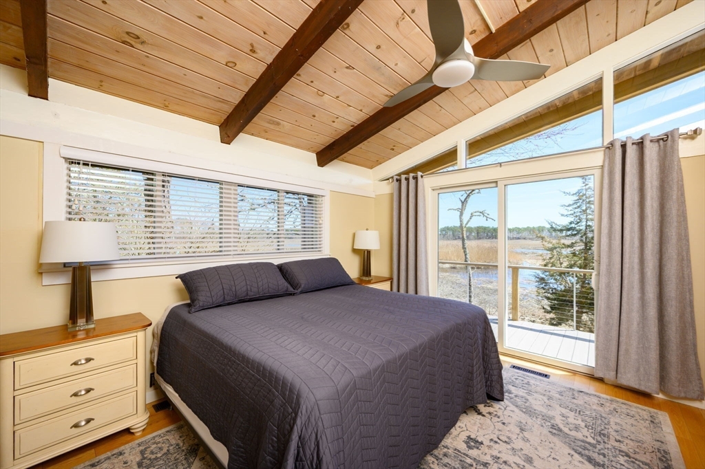 97 Bells Neck Road West Harwich, MA 02671 - Photo 12 of 41 a bedroom with a large bed and a window