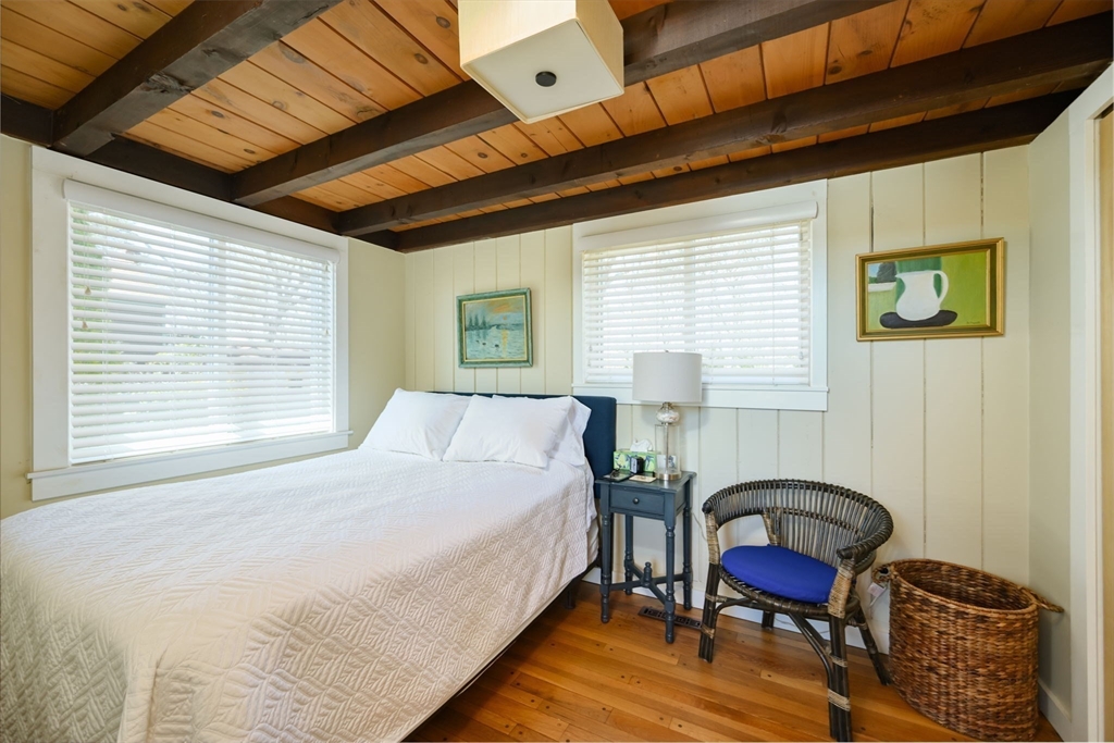 97 Bells Neck Road West Harwich, MA 02671 - Photo 15 of 41 a bedroom with a bed chair and a large window
