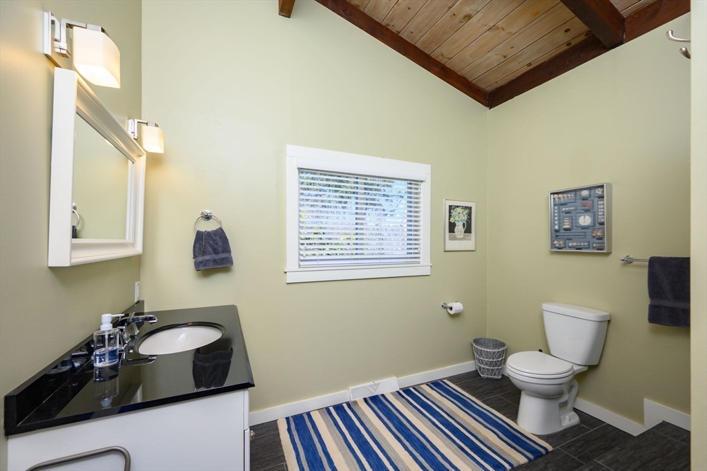 97 Bells Neck Road West Harwich, MA 02671 - Photo 16 of 41 a bathroom with a sink toilet and a mirror