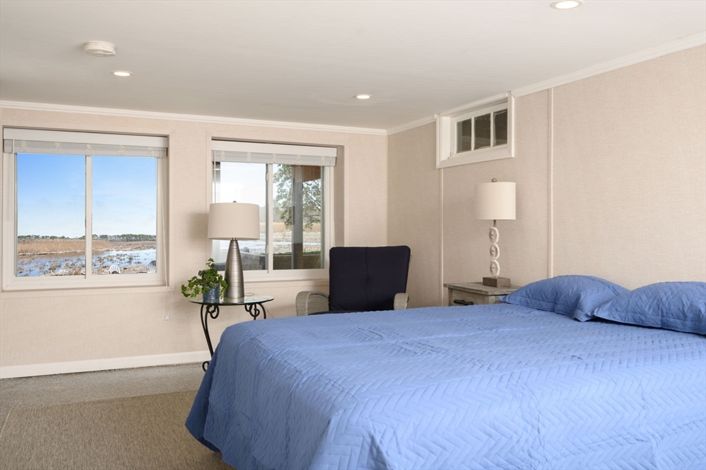 97 Bells Neck Road West Harwich, MA 02671 - Photo 22 of 41 a bedroom with a large bed and a large window
