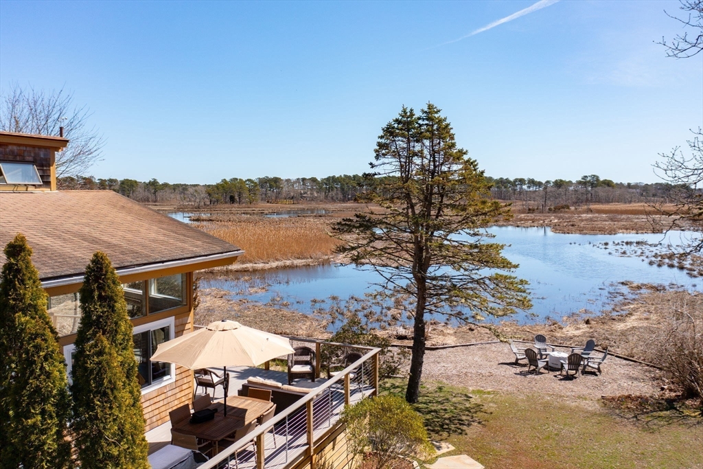 97 Bells Neck Road West Harwich, MA 02671 - Photo 29 of 41 a view of a terrace with chairs