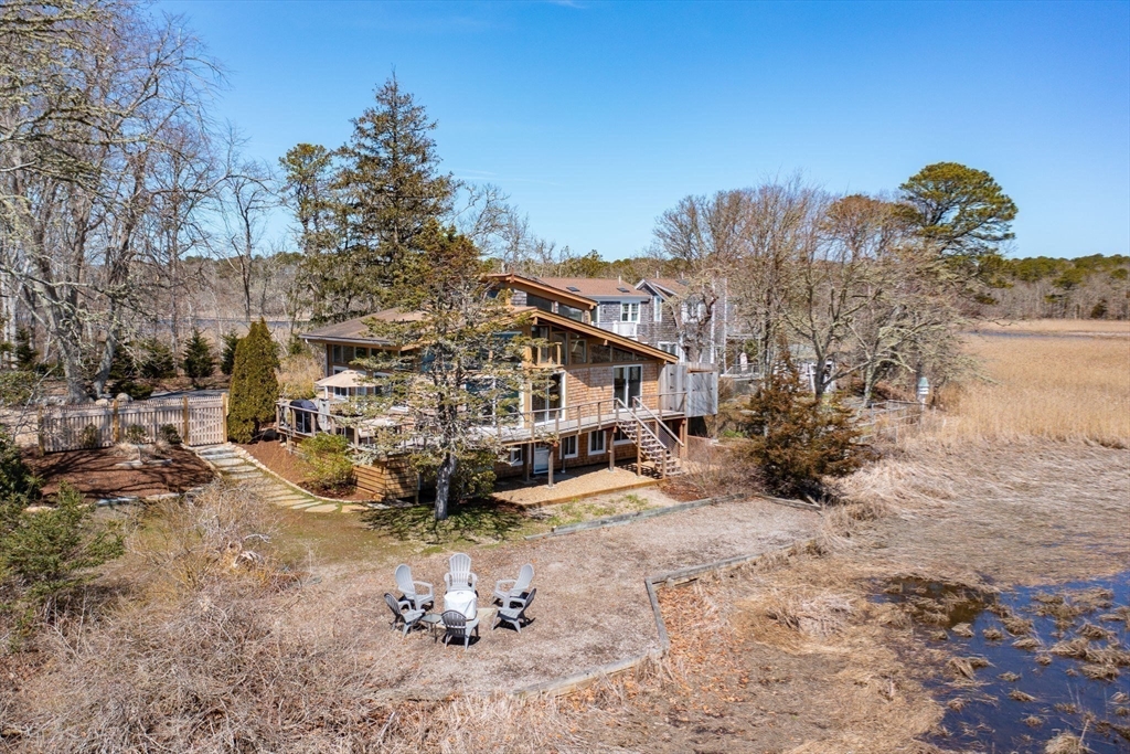 97 Bells Neck Road West Harwich, MA 02671 - Photo 31 of 41 a view of a house with a yard