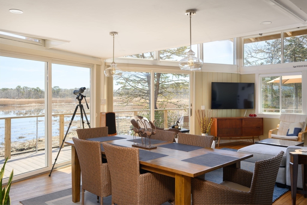 97 Bells Neck Road West Harwich, MA 02671 - Photo 10 of 41 a view of a dining room with furniture window and outside view