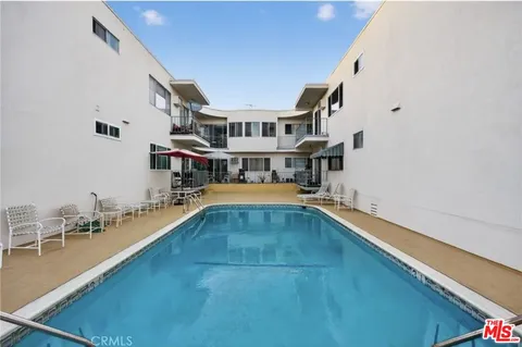 a view of a swimming pool with seating area