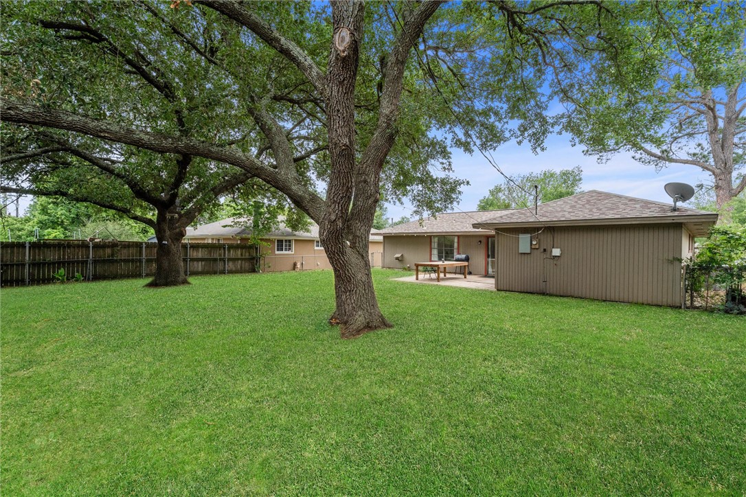 3511 Pecos Court Bryan, TX 77801 - Photo 21 of 22 a view of a house with backyard and a tree