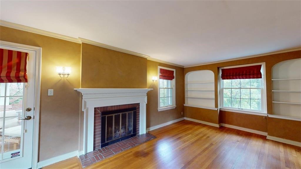 1030 Blackridge Road Pittsburgh, PA 15235 - Photo 10 of 42 Living room, gas fireplace and built-in bookcases