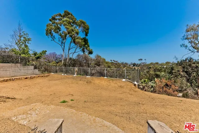 a view of a backyard of a house