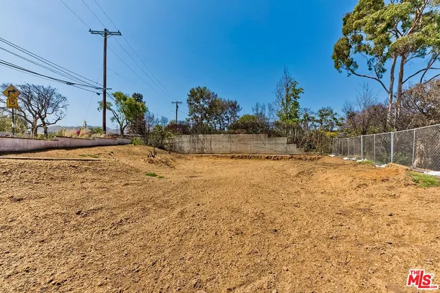 a view of a swimming pool with an outdoor space and seating area