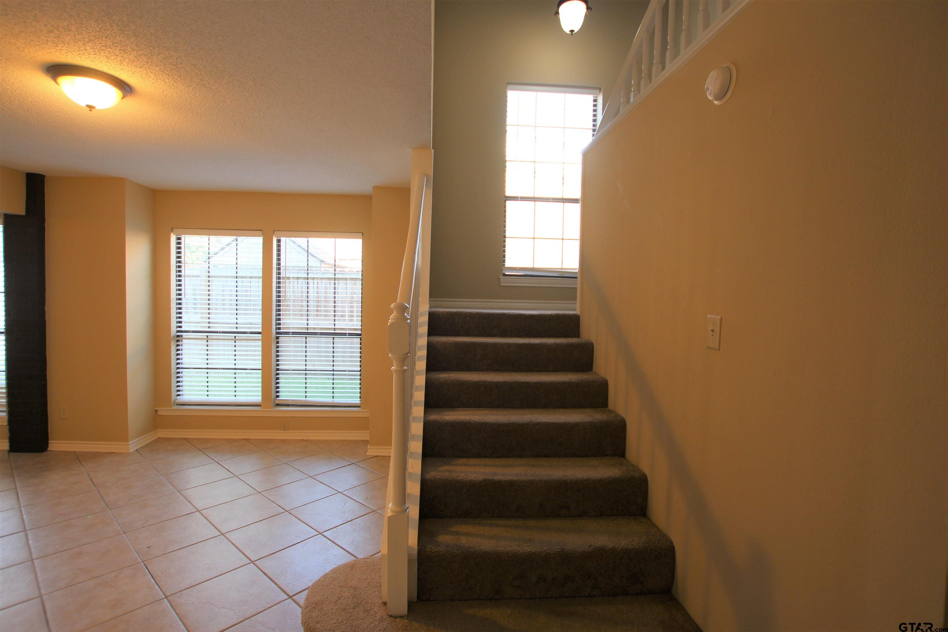 5875 Creekside Circle Tyler, TX 75703 - Photo 16 of 32 a view of entryway with a window and a livingroom