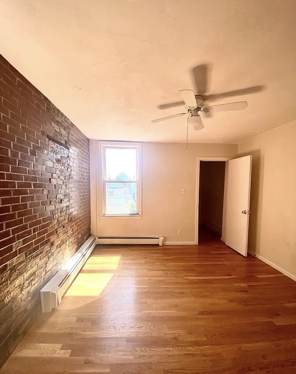 145 Princeton Street, Unit 2 Boston, MA 02128 - Photo 4 of 5 a view of an empty room and window
