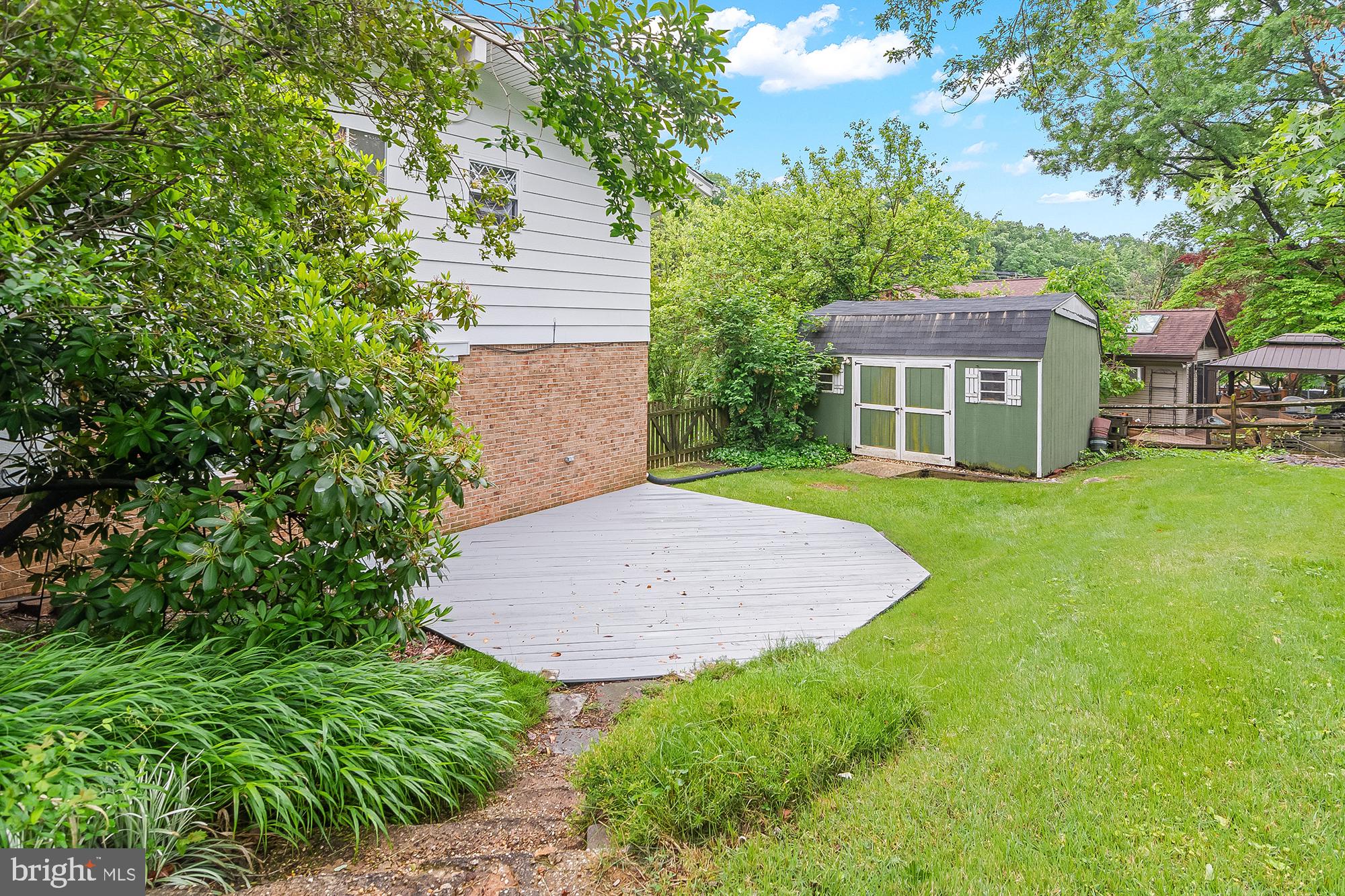 5412 Ridge Road Mount Airy, MD 21771 - Photo 34 of 38 Lush backyard with charming shed.