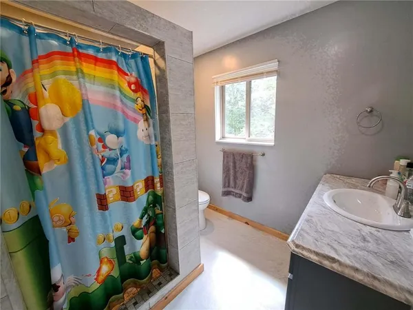a bathroom with a sink a mirror and a bathtub