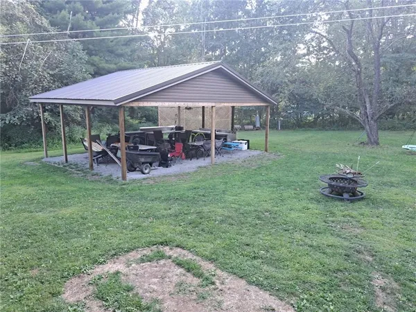 a patio with wooden table and chairs
