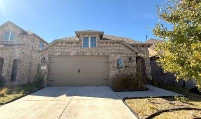 a view of a house with brick walls