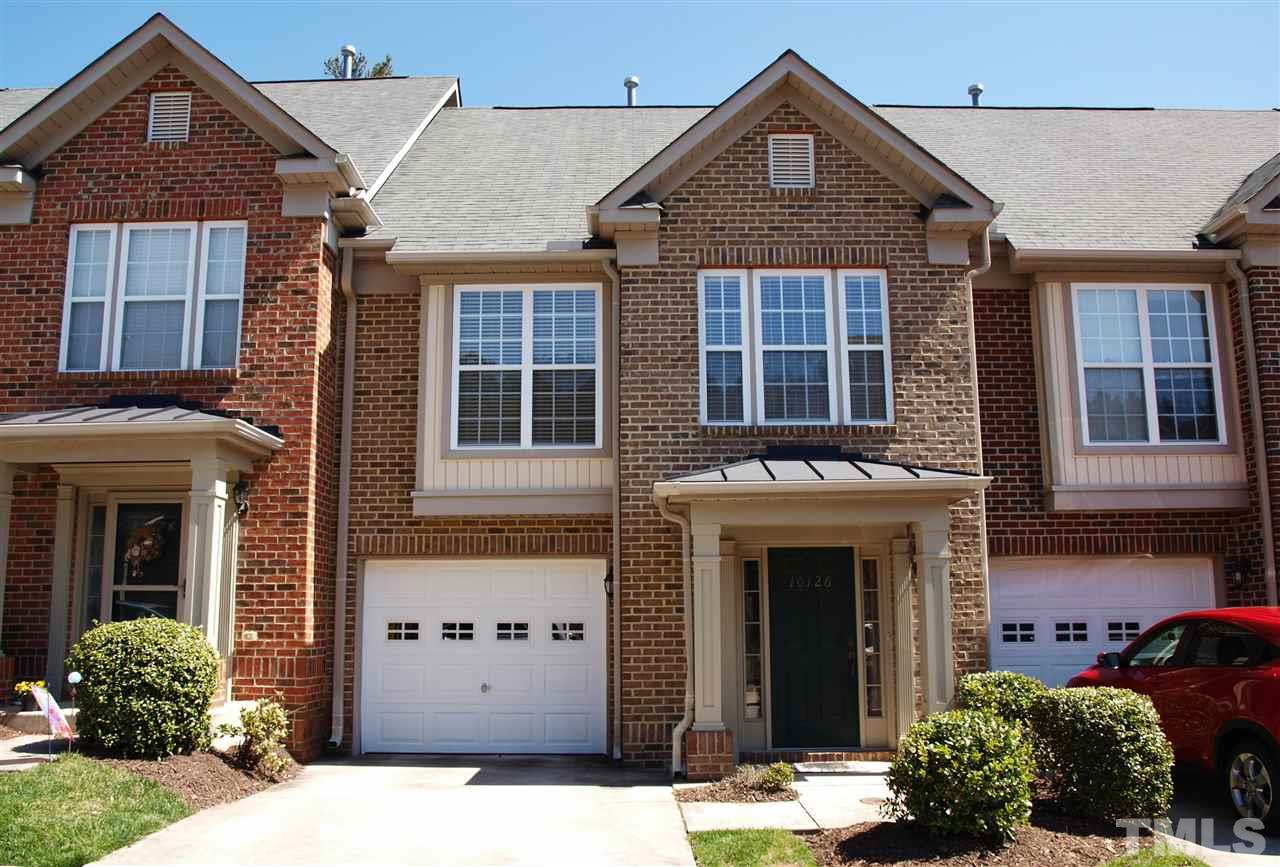 10126 Blackwell Drive Raleigh, NC 27617 - Photo 1 of 14 a front view of a house with a yard