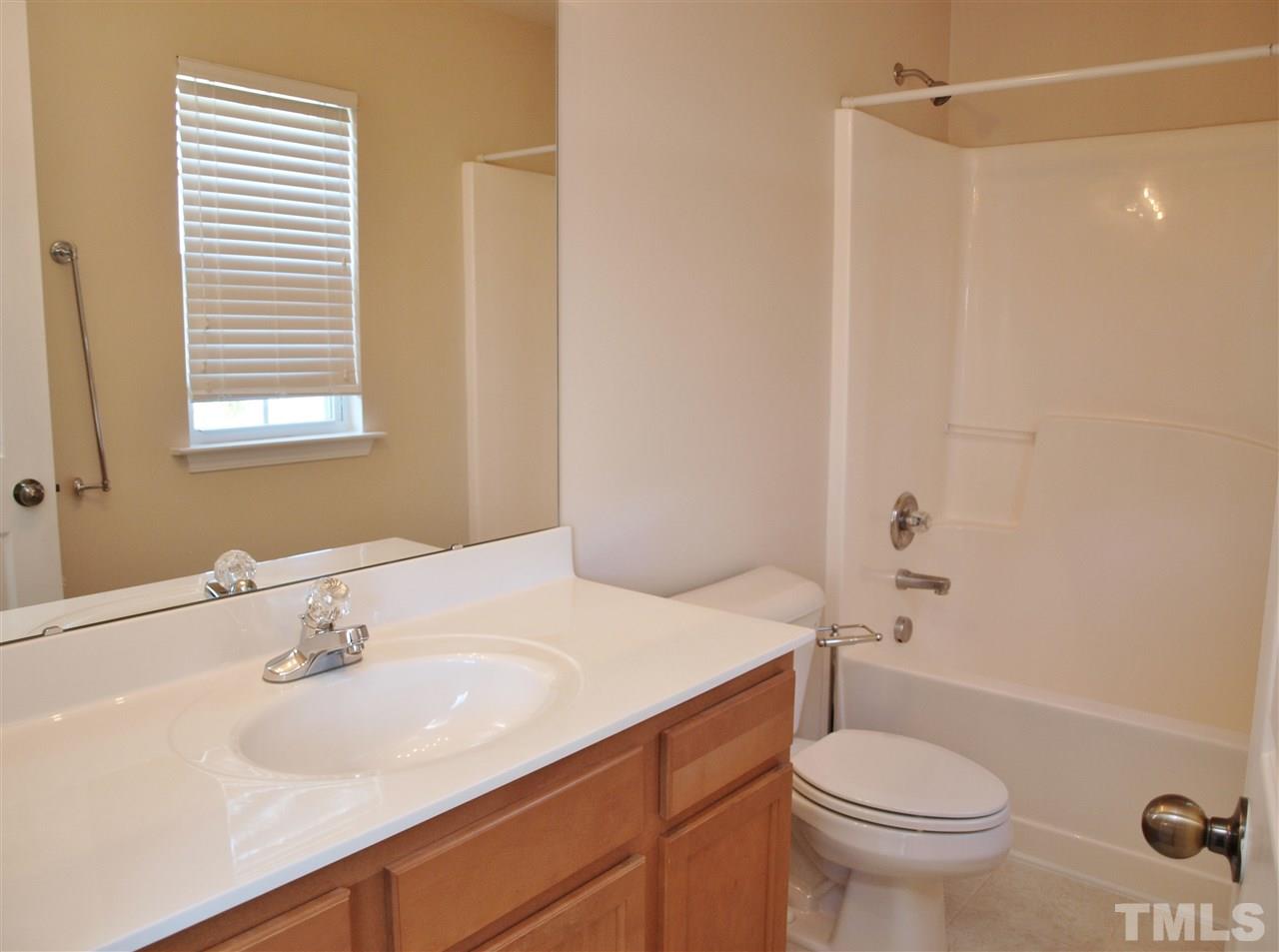 10126 Blackwell Drive Raleigh, NC 27617 - Photo 11 of 14 a bathroom with a sink a toilet and shower