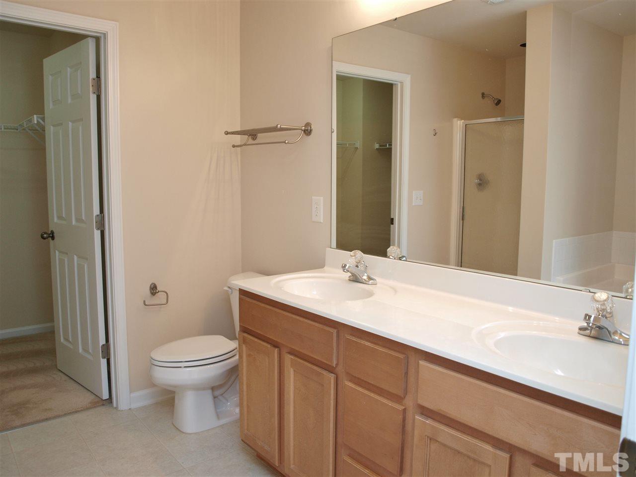 10126 Blackwell Drive Raleigh, NC 27617 - Photo 8 of 14 a bathroom with a sink toilet and shower