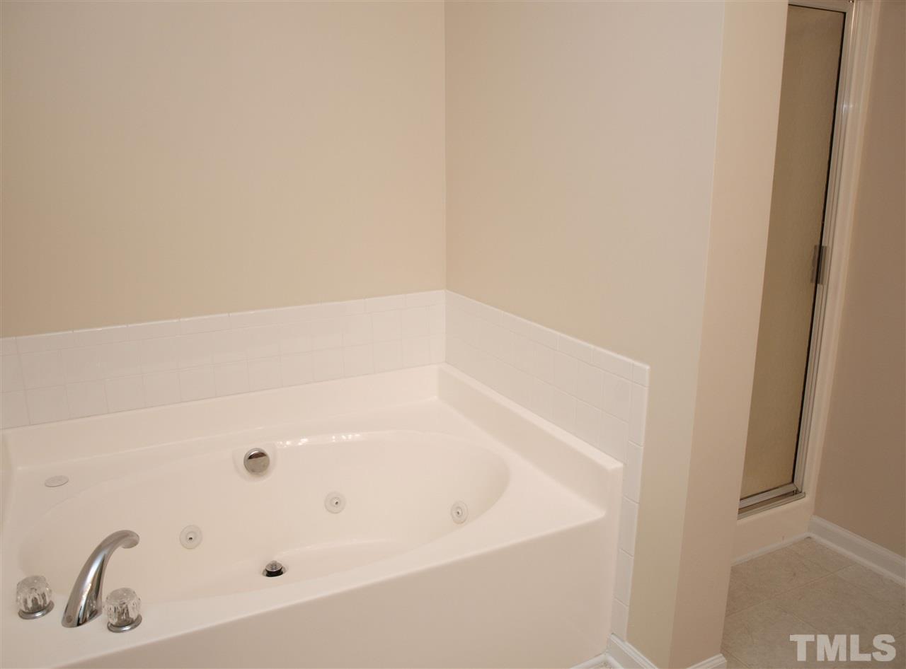 10126 Blackwell Drive Raleigh, NC 27617 - Photo 9 of 14 a bathroom with a bathtub