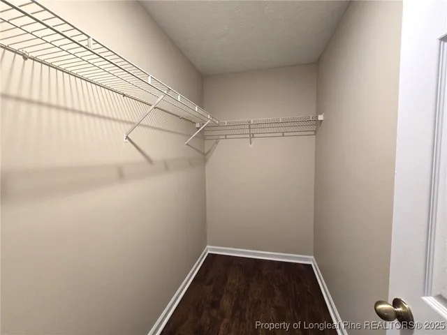 a kitchen with stainless steel appliances a stove a sink and a microwave