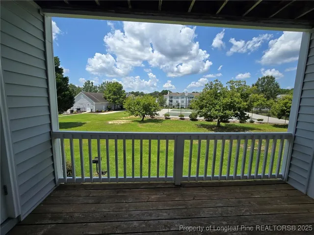 a view of a green field with houses