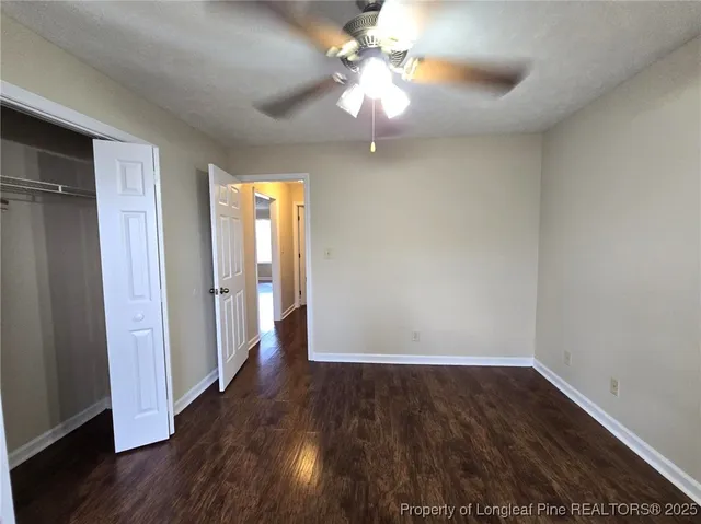 a bathroom with a sink a toilet a mirror and shower