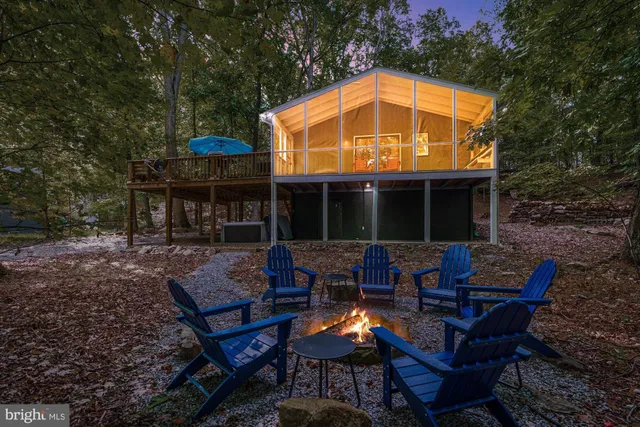 a front view of house with outdoor seating