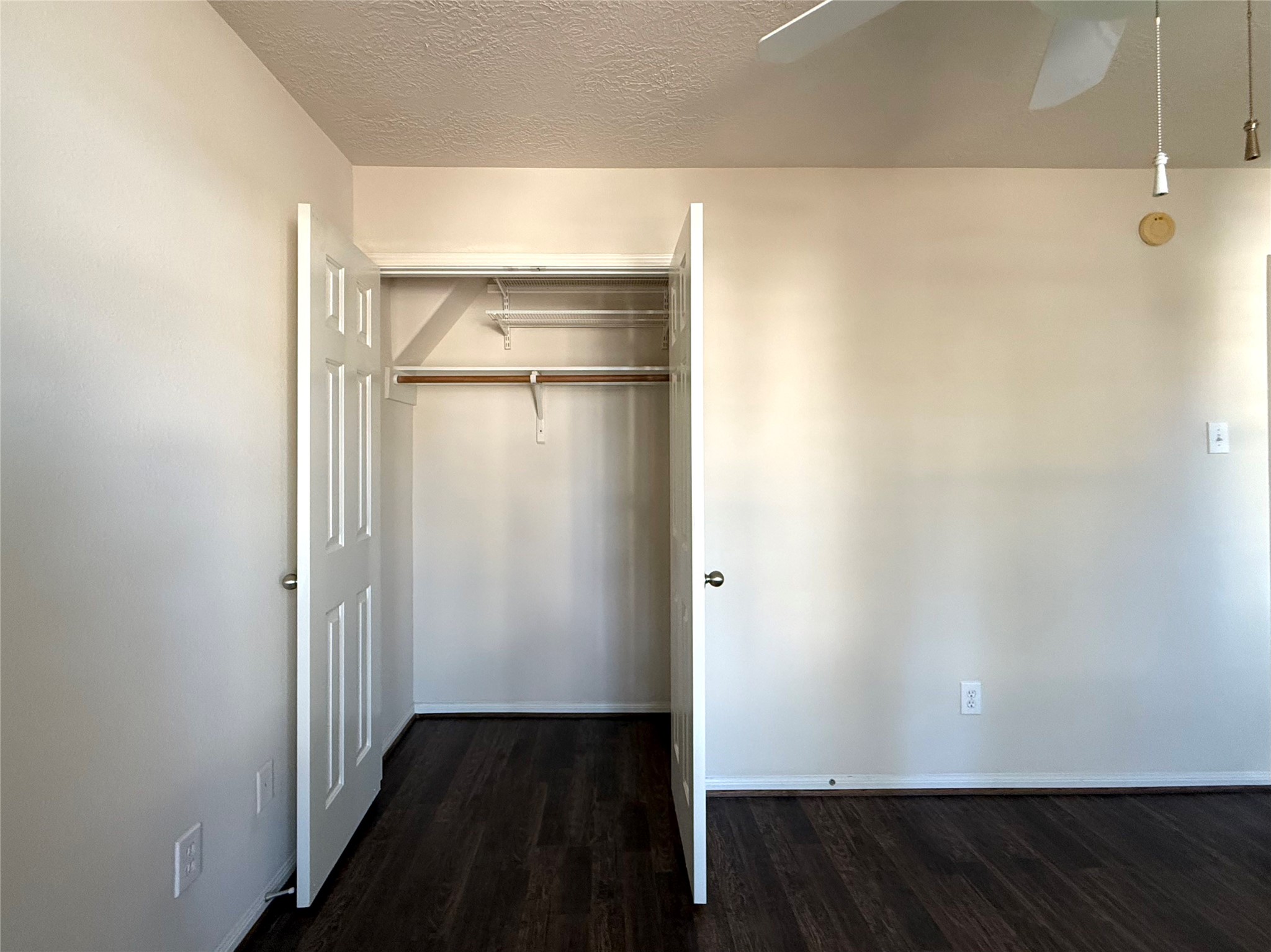 13102 Castlewind Lane Pearland, TX 77584 - Photo 16 of 31 Bedroom closet with double doors offering convenient storage and easy access.