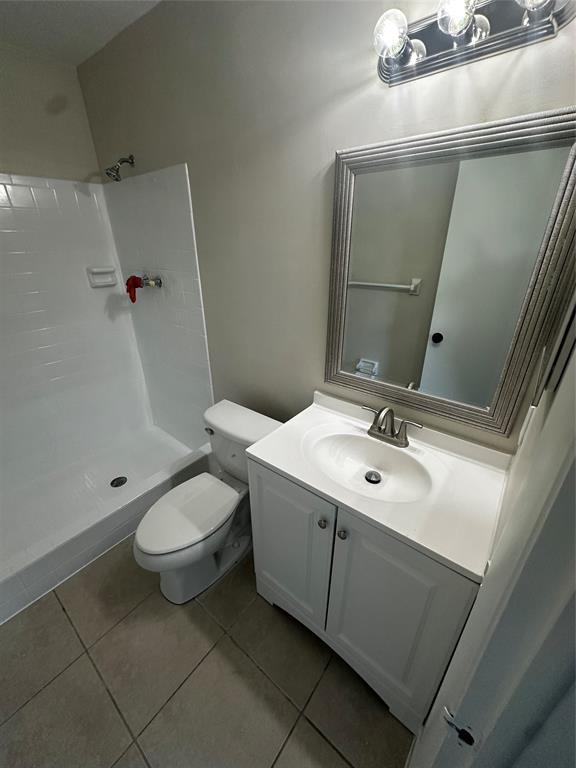 941 Crystal Lake Drive, Unit 201 Deerfield Beach, FL 33064 - Photo 15 of 27 a bathroom with a sink mirror vanity and toilet