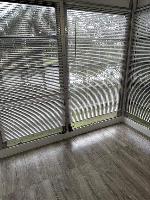941 Crystal Lake Drive, Unit 201 Deerfield Beach, FL 33064 - Photo 27 of 27 a view of empty room with wooden floor
