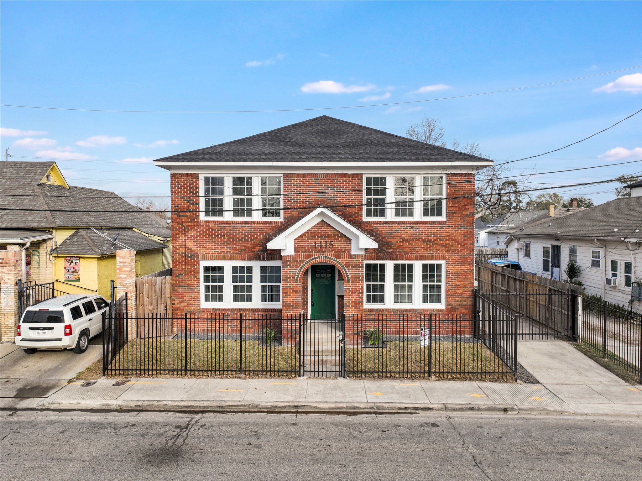 1115 Hogan Street, Unit 1 Houston, TX 77009 - Photo 12 of 12 a front view of a house with a yard