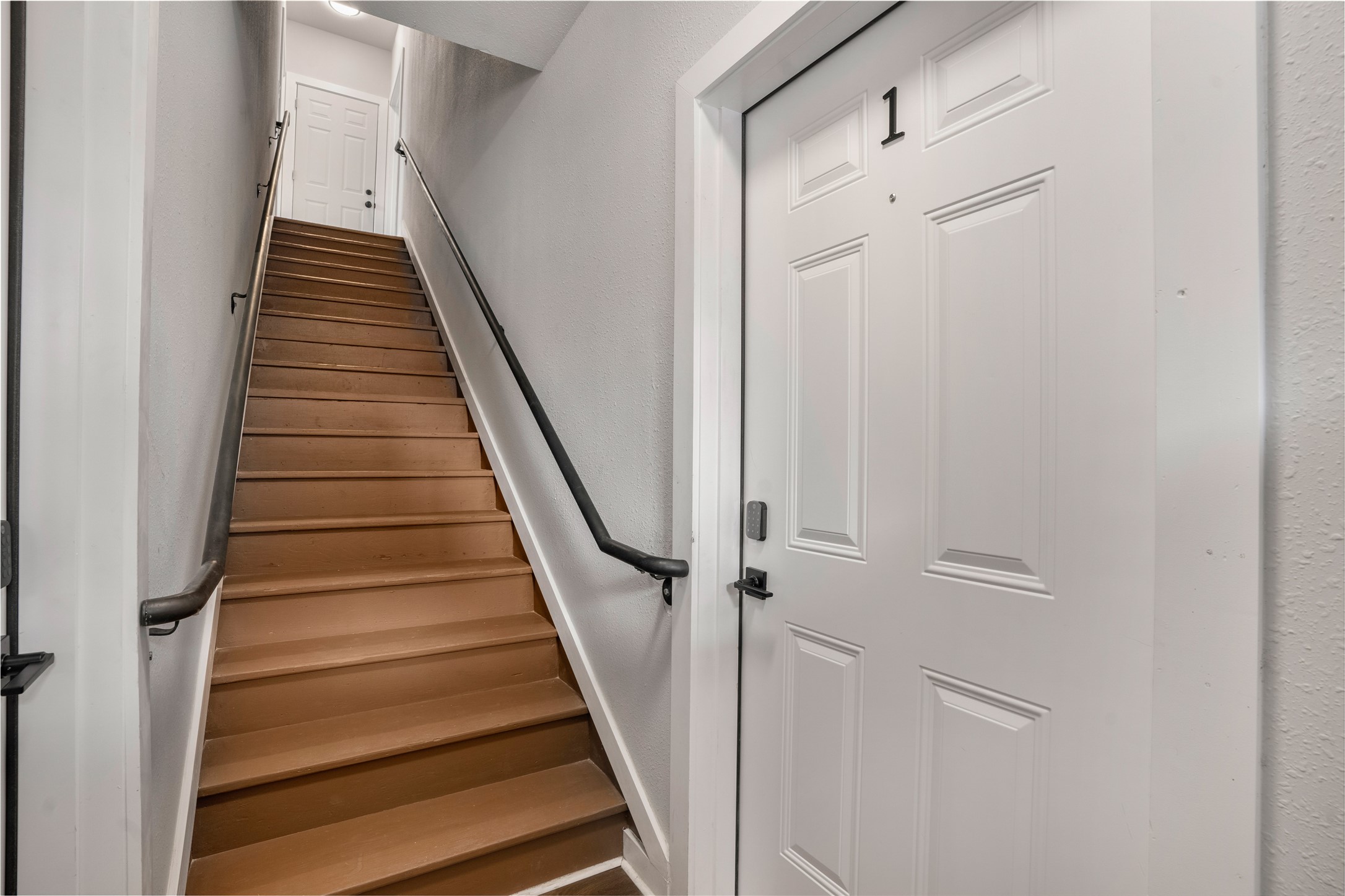 1115 Hogan Street, Unit 1 Houston, TX 77009 - Photo 2 of 12 a view of a hallway with wooden floor and entryway
