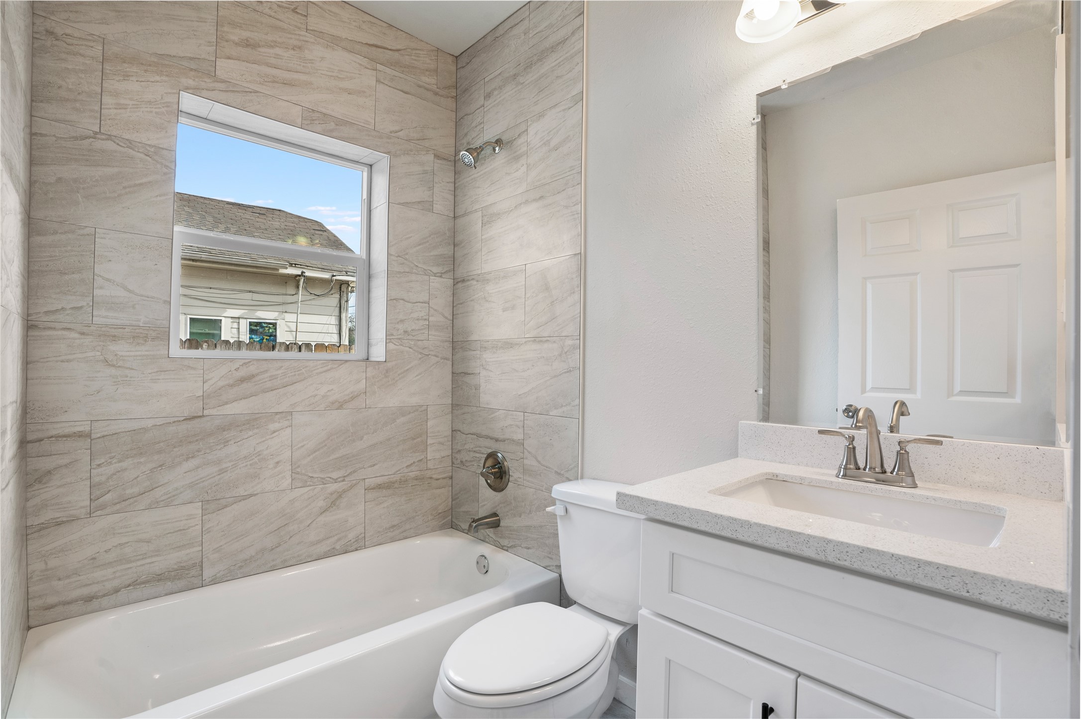 1115 Hogan Street, Unit 1 Houston, TX 77009 - Photo 3 of 12 a bathroom with a sink toilet and bathtub