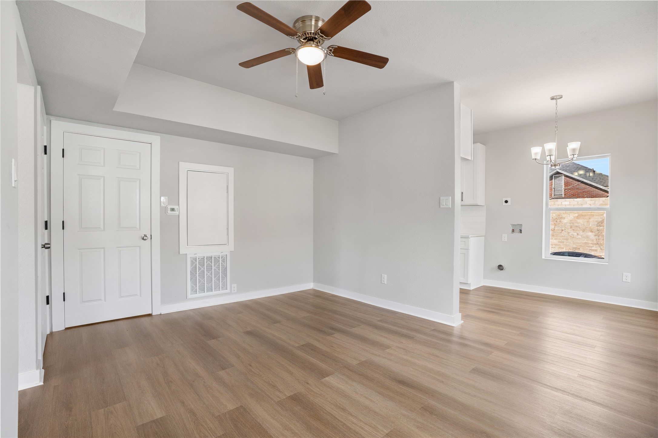 1115 Hogan Street, Unit 1 Houston, TX 77009 - Photo 8 of 12 wooden floor in an empty room with a window