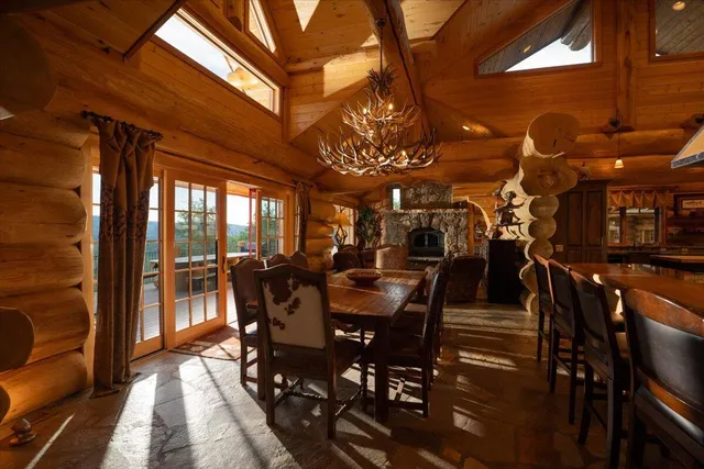 a view of a patio with dining table and chairs with a barbeque grill