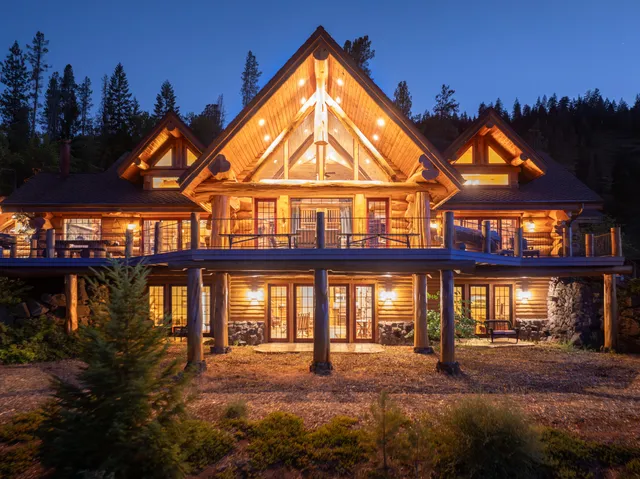 a view of a town with mountains in the background