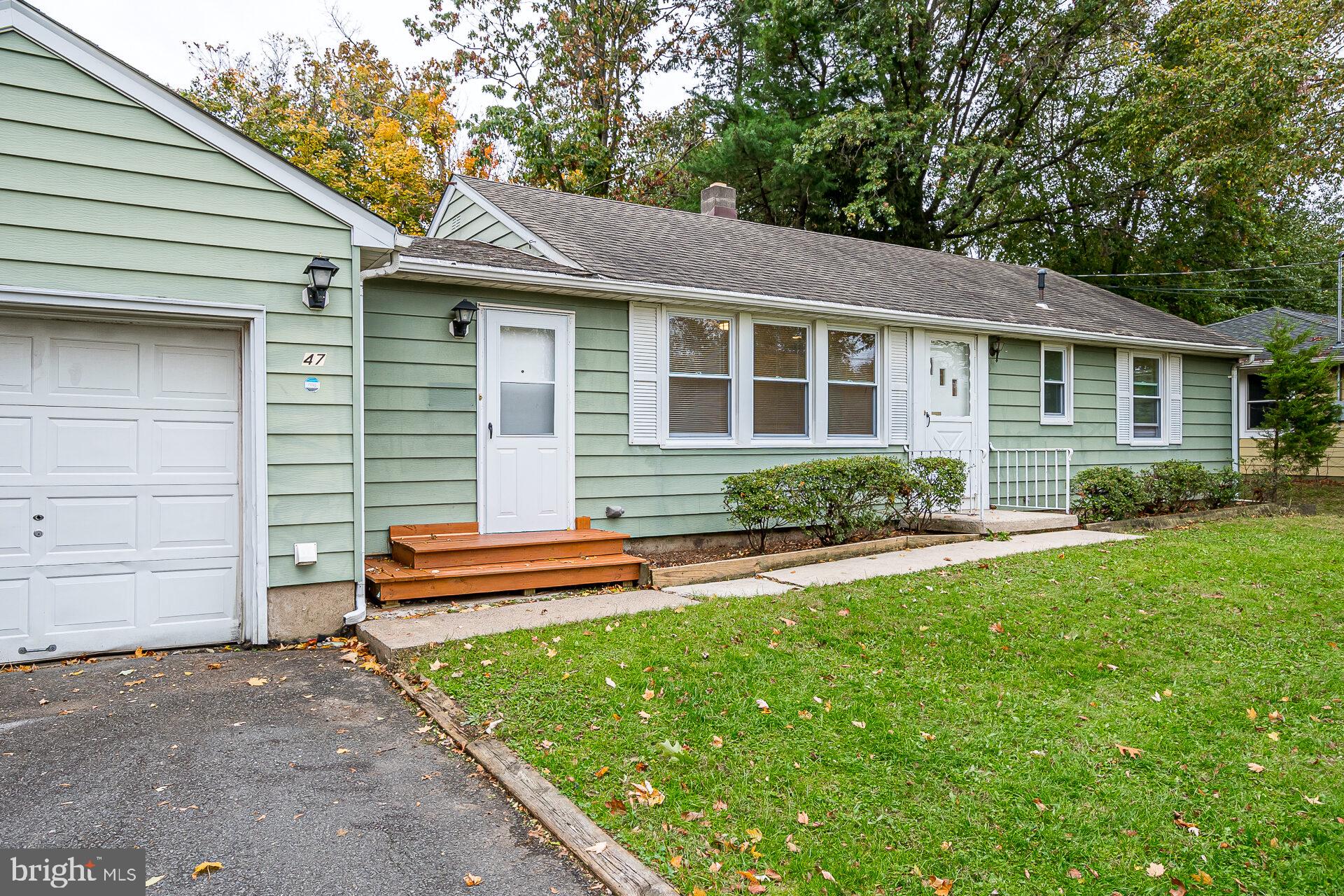 47 Wallace Road Princeton Junction, NJ 08550 - Photo 2 of 27 a front view of a house with a yard